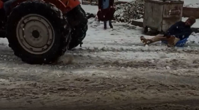 Kar üstünde leğenle snowboard yaptı